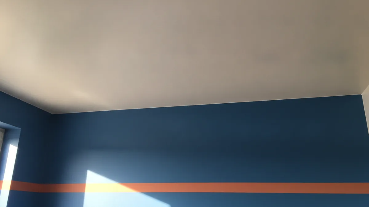 Bathroom walls and ceiling with clean satin or eggshell sheen under soft light.