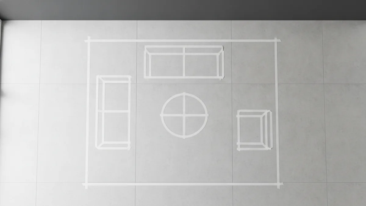 Taped rug outline on the floor for accurate living room sizing